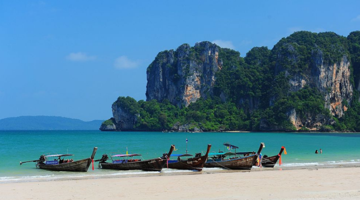 krabi, thailand - image of boats on the beach