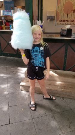 Photo of girl with giant cotton candy stick