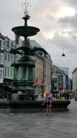 Photo of two girls by a fountain in Copenhagen, Denmark