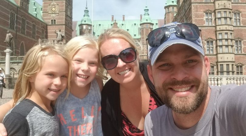 Family selfie in front of Frederiksborg Castle, Denmark