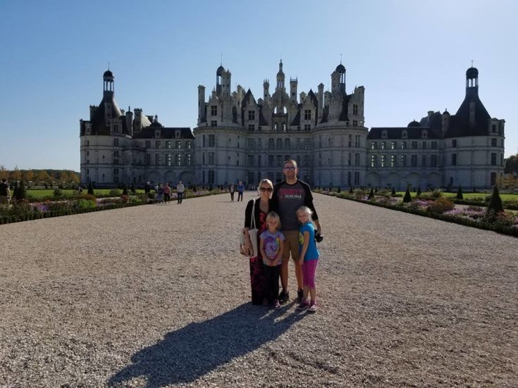image of family in front of Chambord in France
