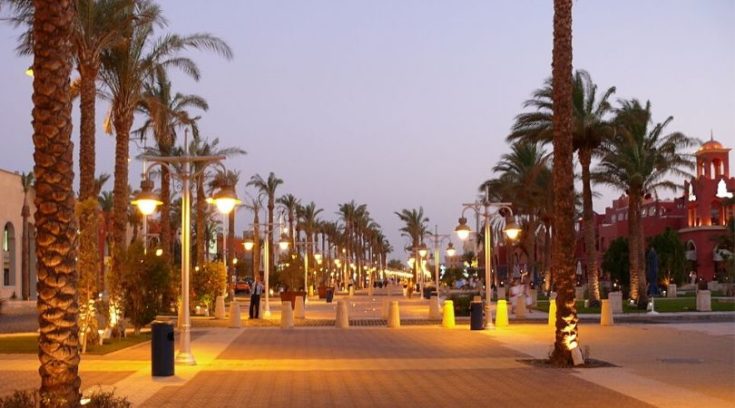 image of sidewalk with palm trees in Hurghada, Egypt