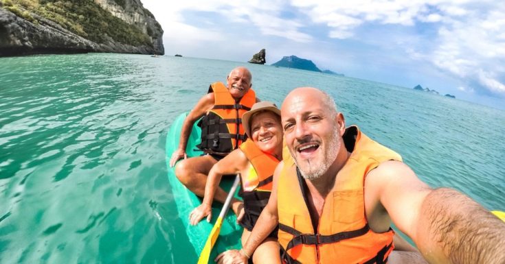Amex Travel Insurance Review - picture of three seniors in kayak taking selfie