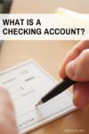 What is a checking account Pin - closeup of hand writing a check