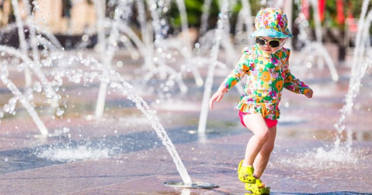 Tampa Bay CityPASS Review - picture of toddler girl running through splash pad